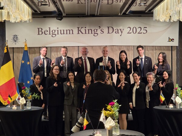 Belgium Amb. Bruno Jans, third from left on the rear row, poses with staff from the Embassy of Belgium in Seoul to mark his country’s King’s Day 2025. The event took place last week in Seoul. [Photo courtesy of Embassy of Belgium]