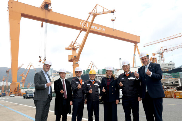 Canada’s Minister of Innovation, Science and Economic Development Mélanie Joly, third from left, poses at the Hanwha Ocean shipyard in South Korea on Nov. 24. Hanwha Ocean leaders and government officials from the two countries also joined her visit. [Photo courtesy of Hanwha Ocean]